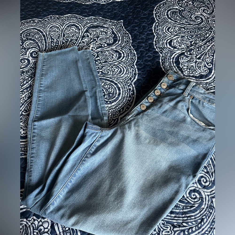 Faded blue jeans.  Size 13.  / 31   New York Rewash Brand. Frayed bottoms.